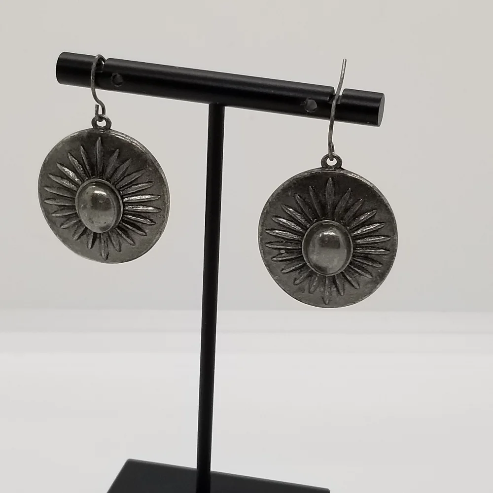 silver tone starburst dangle earrings